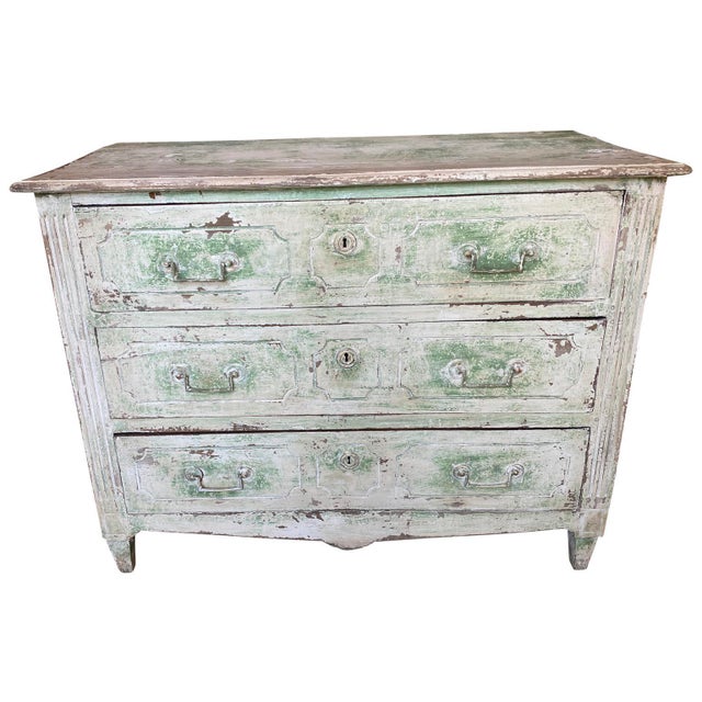 A very lovely 18th century Louis XVI period commode in painted wood with three drawers over tapered feet originating from...