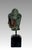 An eye catching image of Buddha mounted on a high quality black square pedestal. Identified as a depiction of Bodhisattva...