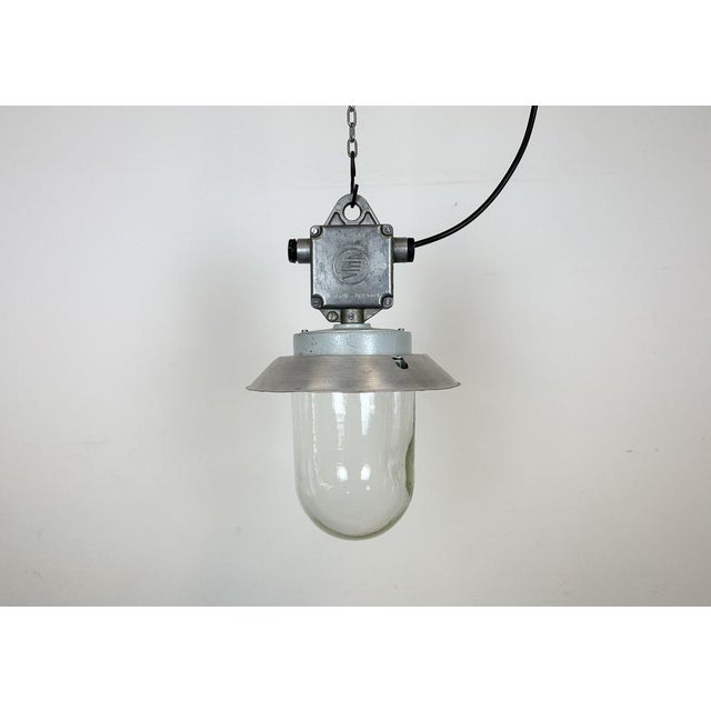 This Industrial wall light was made by Elektrosvit in former Czechoslovakia during the 1970s. It features a cast aluminium...