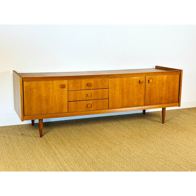 Stunning vintage sideboard with a Scandinavian design from the 1960s. This elegant piece captivates with its clean lines,...