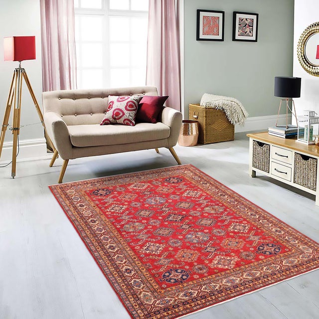Enhance your home with this exquisite hand-knotted Super Kazak rug, crafted from fine hand-spun wool and dyed with all-...