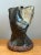 Hand-sculpted with expressive organic movement and raw tactile texture, this vintage studio pottery vase features an...