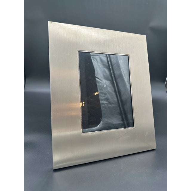 This vintage Italian picture frame by Liwan's is a sophisticated piece from the 1980s. Crafted with a sleek, modernist...