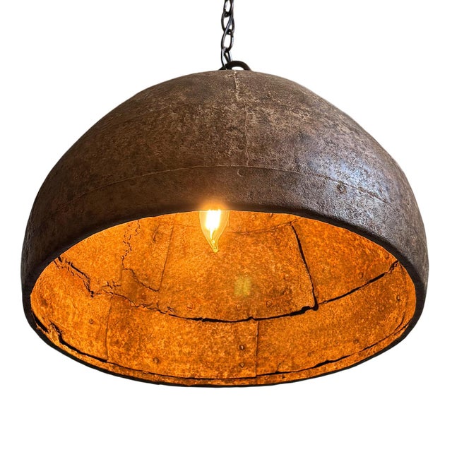 Vintage iron pendant light crafted from a hand-forged bowl from early–mid 20th century India. Such vessels were...