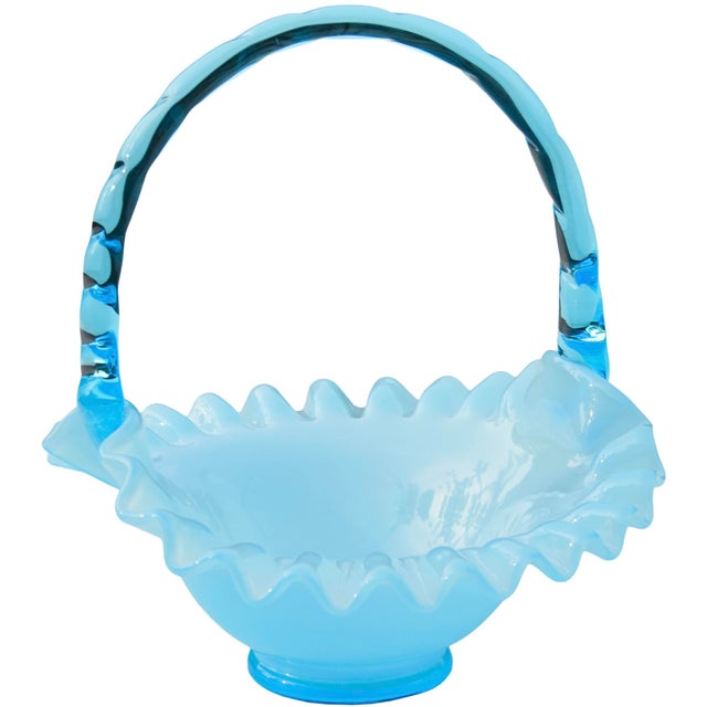 A rare midcentury handblown blue art glass basket exhibiting elegant ruffled edges and fine textured details. We love how...