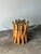 This vintage dining table lets the base do all the talking — dozens of natural bamboo poles, varying in diameter and cut...