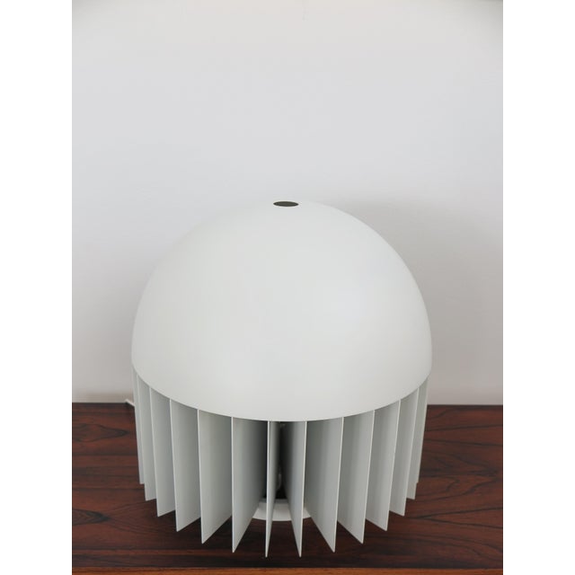 MT table lamp designed by Giancarlo Mattioli and produced by Sirrah, featuring a lacquered aluminum shade and slats with...