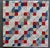 Found in New Hampshire. This mid-weight quilt is hand-stitched and hand-quilted in beautiful squares of small prints,...