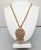 1960s goldtone 2-strand twisted chains with textured openwork 2-part articulated pendant with seven drops necklace with...