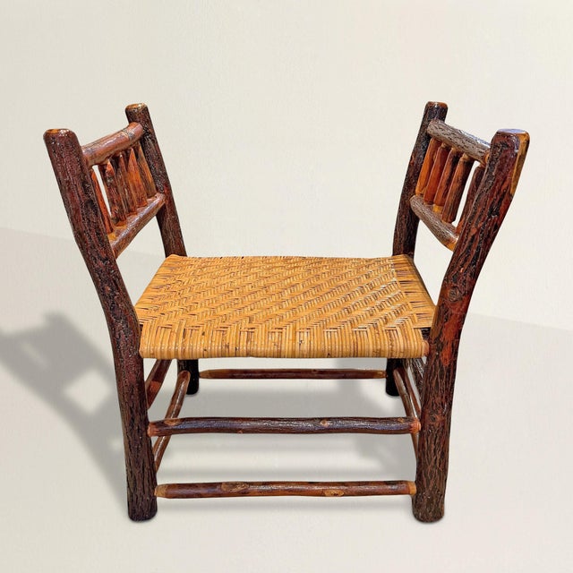 This is not a polite bench. It has presence. A vintage American Old Hickory bench that knows exactly where it came from...