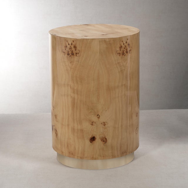 The burl wood veneer stool with its smooth surface, works well in a variety of interior settings such as seating or side...