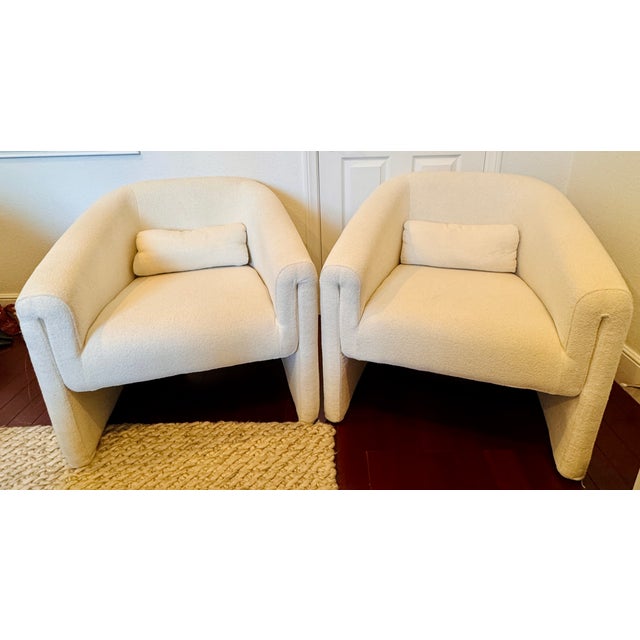 Ivory Bouclé Lounge Chairs – Pair A beautifully crafted pair of sculptural lounge chairs upholstered in luxurious ivory...