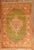 An early 20th century Antique Turkish Oushak rug highlighted by a rare green color ground. Measures: 4' x 6'6''.