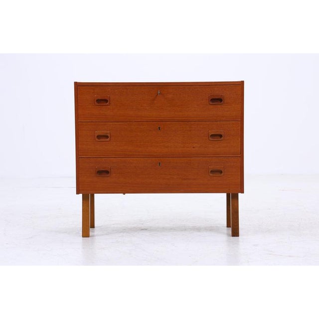 Beautiful Mid-Century Teak Chest of Drawers FEATURES • High-quality workmanship • 3 drawers with one key • Material: Teak...