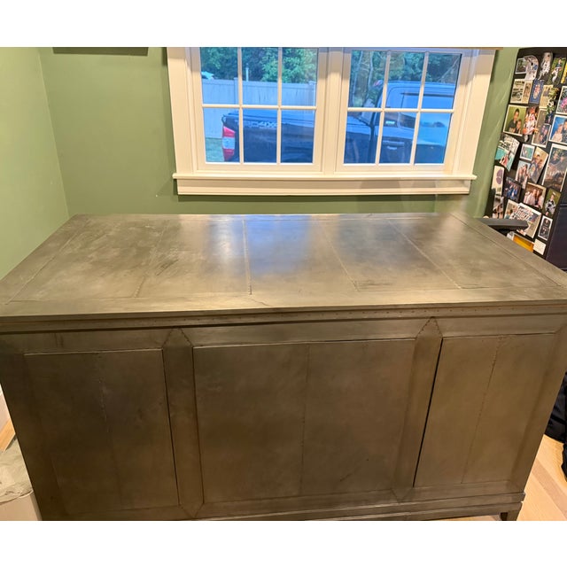 RH metal desk with 7 drawers. Bottom drawers are intended to store files. Top has signs of wear.