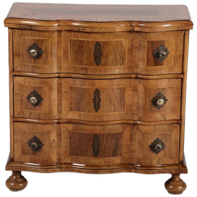 Age and Origin: The chest of drawers is likely from the 20th century and probably originates from Germany. Material: The...