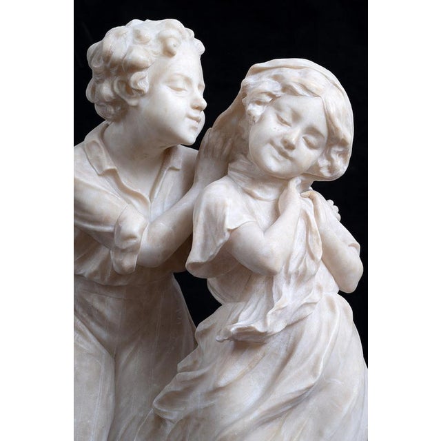: Antique alabaster sculpture depicting love, dating back to the second half of the 19th century and signed by A. Del...