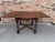 This is a great little English game table/draw leaf table measures 60' with both leafs extended. The wood is dark oak the...