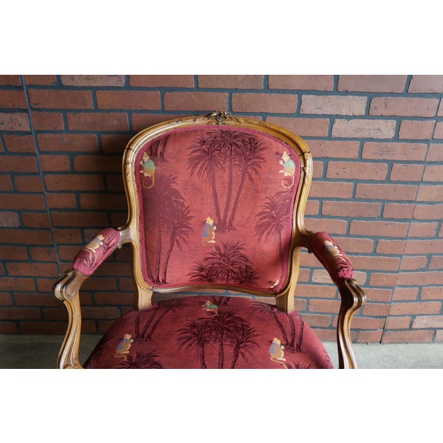 Parisian charm is showcased in this antique hand carved wooden frame chair. The fabric adds an eclectic spin featuring...