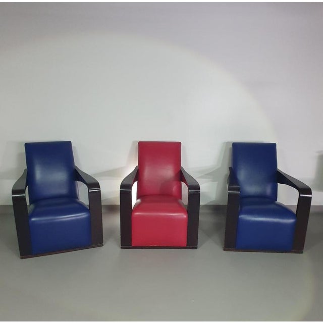 4 x Vintage Ying lounge chairs / fauteuils van Hugues Chevalier, 1990. 3 x blue / 1 x red leather. Special made in these...