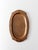 This vintage hammered copper tray by Schaefer features a richly textured surface framed by a segmented oval rim. The warm...