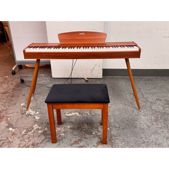 Design Plus Gallery presents the DDP-80 Digital Piano + Stool from Donner. The set offers a mid-century modern silhouette...