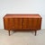 Sleek sideboard of Polish origin from the 1960s. Originally a wall unit, the top is visibly divided into two sections....
