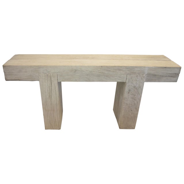 Reclaimed bleached teak log console with an added light white wash finish. The two top pieces rest on a minimalist teak...