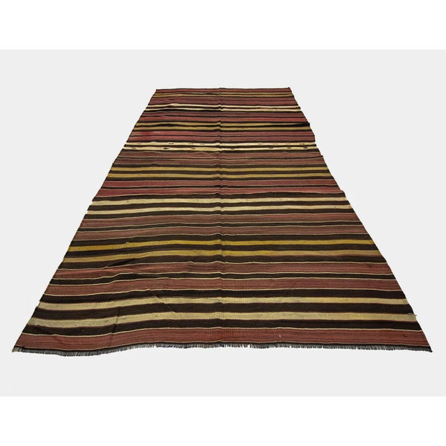 Vintage striped hand woven Kilim rug from Afyon region of Turkey. Approximately 50-60 years old. In very good condition