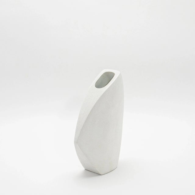 The Shagreen Oval Vase with the Side Cut Top is a stunning embodiment of refined craftsmanship and luxurious design....