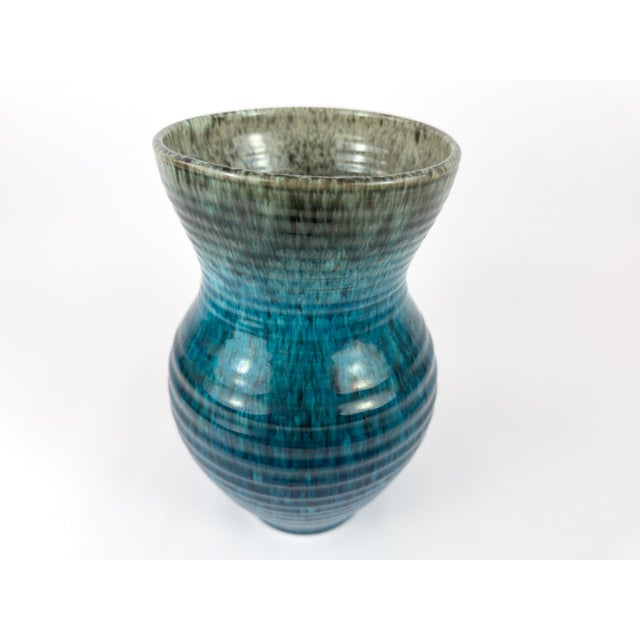 Mid-century French stoneware vase signed Accolay, circa 1960. This sculptural vase features a ribbed body with a waisted...