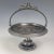 This antique Pairpoint Mfg. quadruple silver plated pedestal fruit compote or bride's basket has an intricate aesthetic...