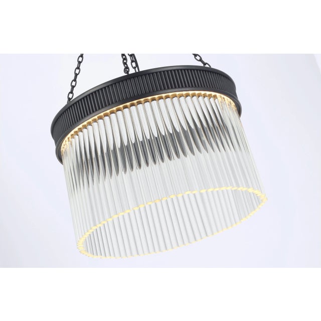 Menil Medium Chandelier in Bronze with Crystal Rods Designer: Marie Flanigan Canopy: 6" Round Mounting: Chain Shade...