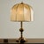 A truly classic and elegant piece. Brass table lamp with rounded shapes from the 1970s. The surface of the lamp has some...