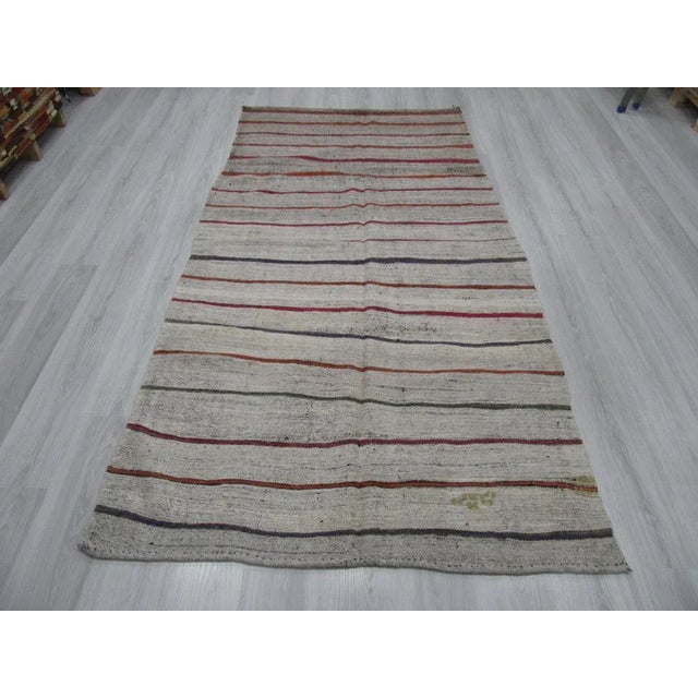 Vintage striped Kilim rug from adana region of turkey.Approximately 45-55 years old.In good condition