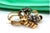 Gold and silver brooch in an interlaced shape with diamond flakes in the flowers. Metal: Gold - Silver. Origin:...