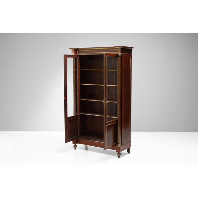 French mahogany Empire style part glazed 2 door bookcase with applied brass beading. Circa 1890.