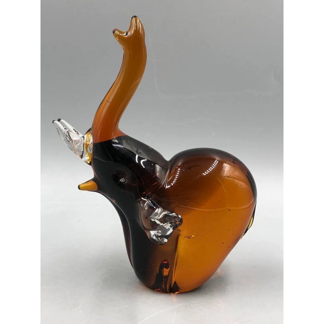 Fascinating Murano glass elephant figurine that combines artistry and elegance. This handcrafted figure exudes the unique...