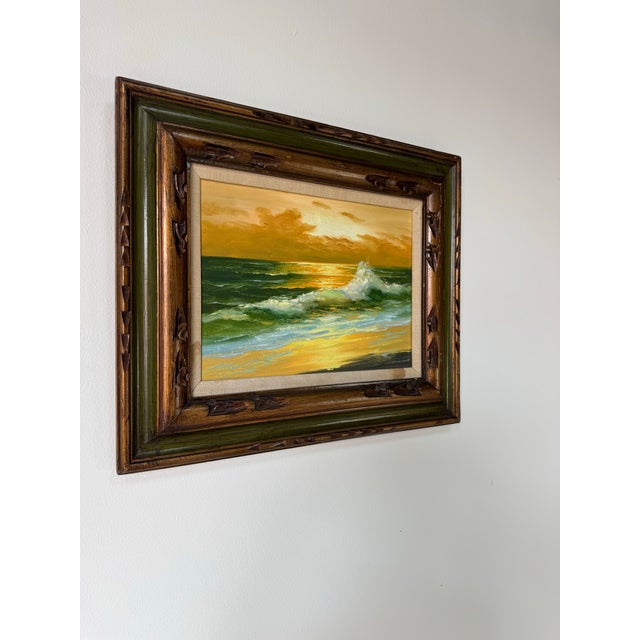 A vibrant 1980’s ocean landscape capturing the golden glow of a radiant sunset as waves crash gently along the shoreline....