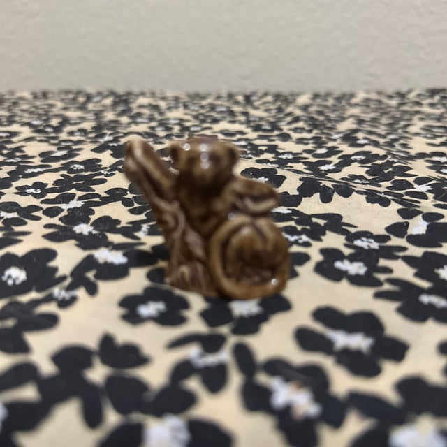 This miniature figurine is a Vintage Wade Whimsies "Langur" (often referred to as a Lemur or Monkey), manufactured by...