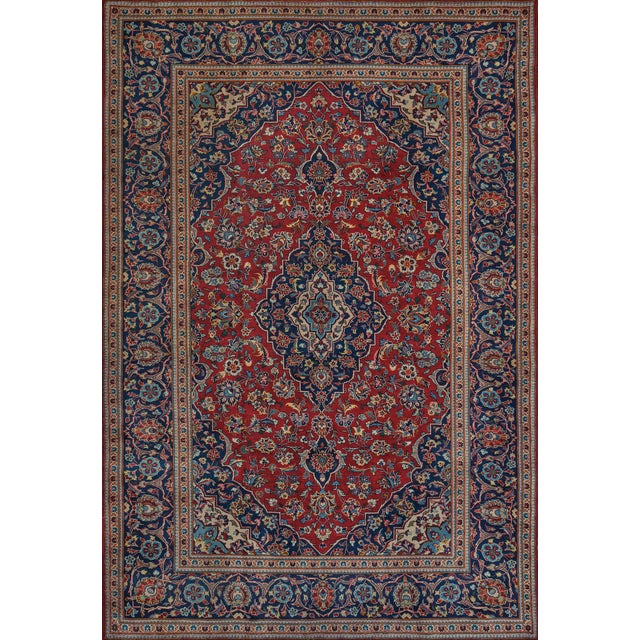 A genuine handwoven Kashan rug from Central Iran. The classic Persian design with rich colors and a beautiful central...