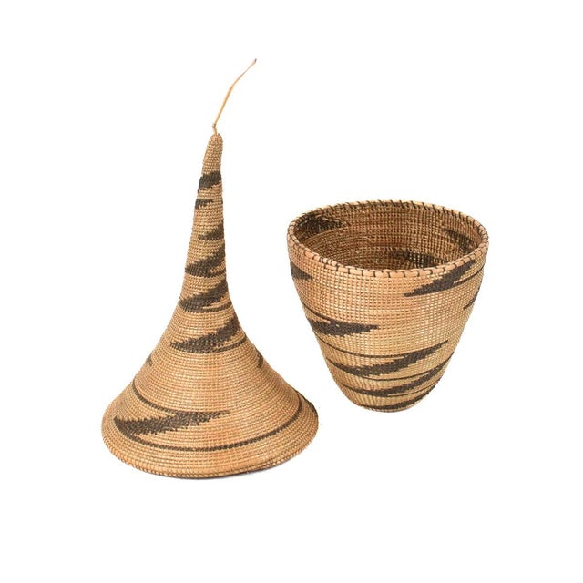 The Tutsi Tight Weave Basket with Lid from Rwanda epitomizes the artistry and tradition of the Tutsi community's weaving...