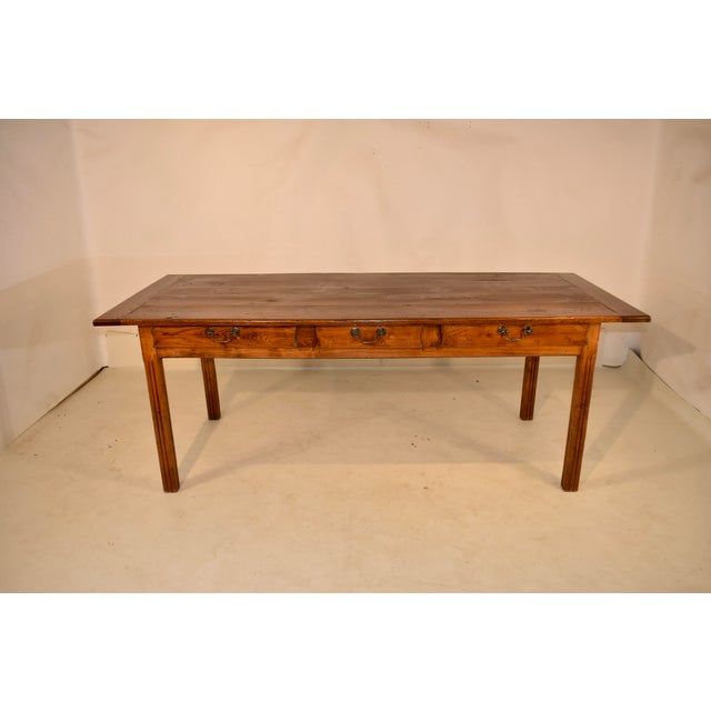 18th century farm chestnut table from France. This is an absolutely stunning farm table with a three board top that has...