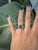 A mesmerizing 4-star sapphire displays a celestial glow, accented by earth-mined diamonds for refined brilliance. Set in...