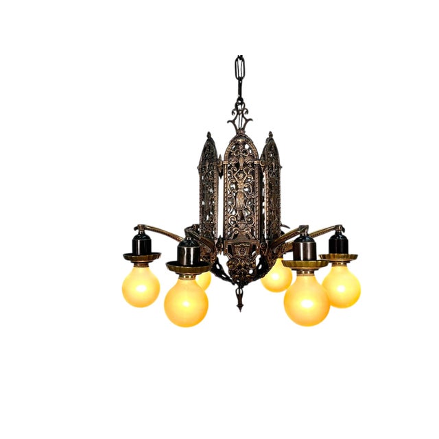 Excellent original patina on this cast bronze chandelier from the 1920s. This is an unusual 6 light; 5 bulbs is more...