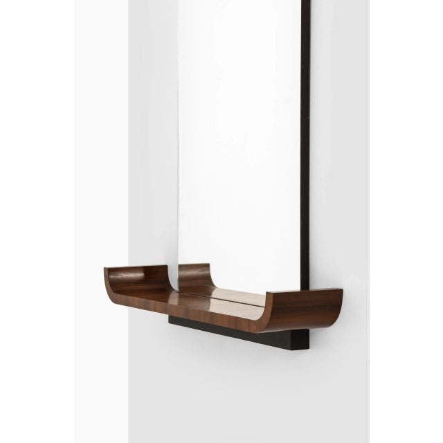 Rare mirror with shelf model Typenko designed by Axel Einar Hjorth. Produced by Nordiska Kompaniet in Sweden. This piece...