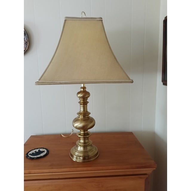 Bring timeless warmth into any space with this beautifully crafted solid brass table lamp, featuring a polished,...