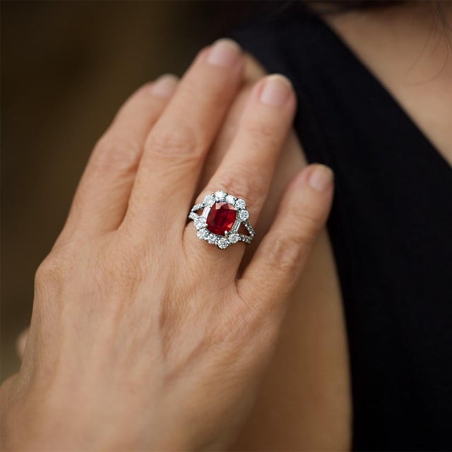 Platinum ring with GIA no heat ruby weighing 3.07 carats and 2 baguet and 26 round diamonds weighing 1.89 carat. 8.77 grams
