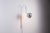 This elegant adjustable wall lamp, designed by Danilo and Corrado Aroldi and produced by Stilnovo, exemplifies the...