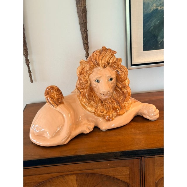 A magnificent signed 1970s reclining ceramic lion sculpture executed with exceptional craftsmanship and impressive scale....